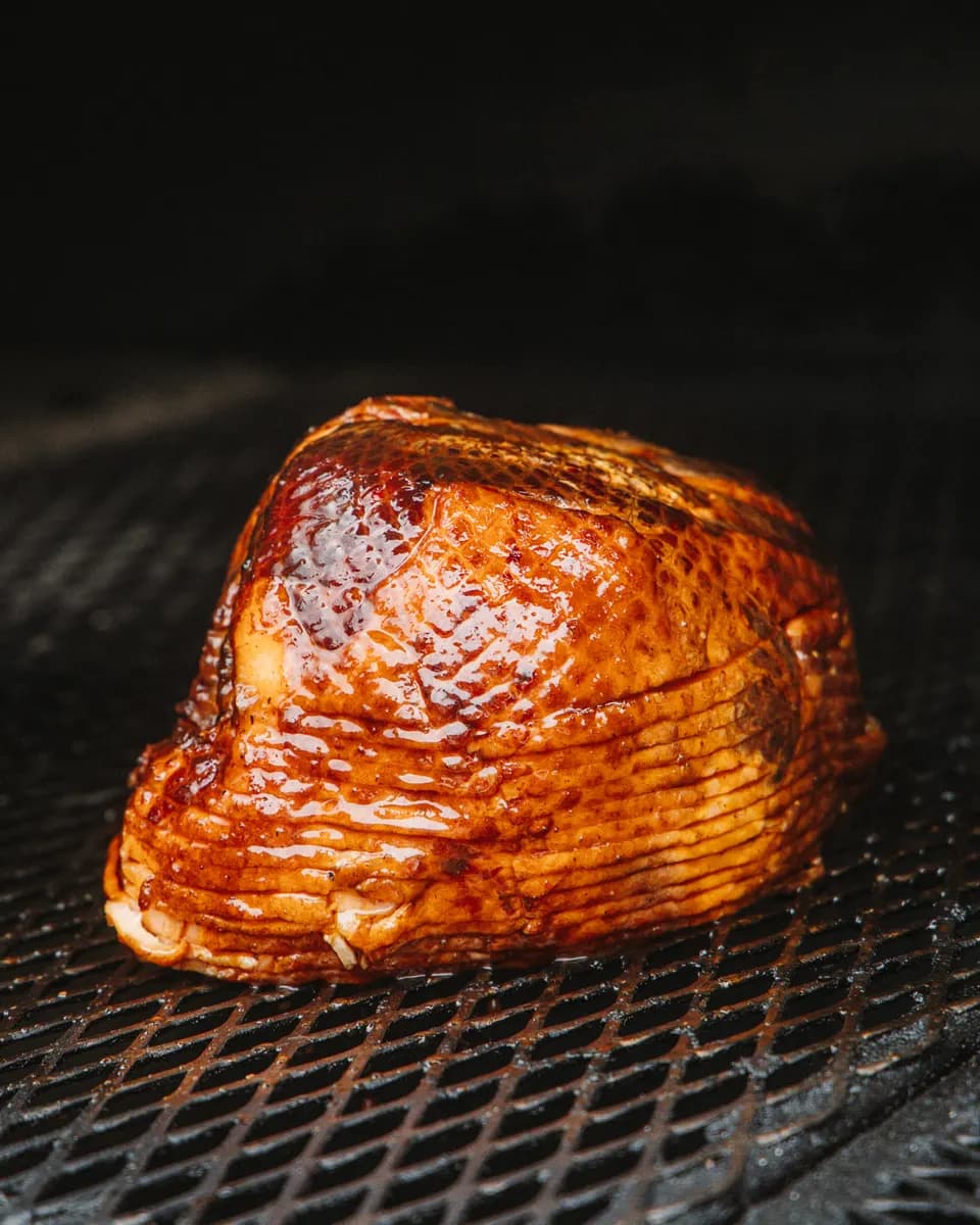 A glazed spiral-sliced ham on the pit